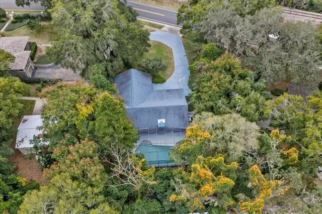 an aerial view of a residential houses with outdoor space