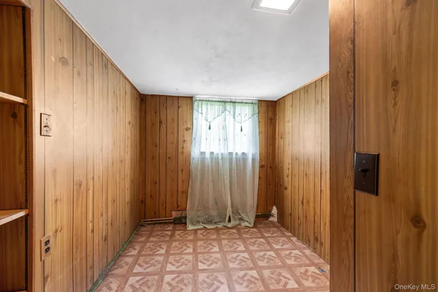 a view of an entryway with a hallway