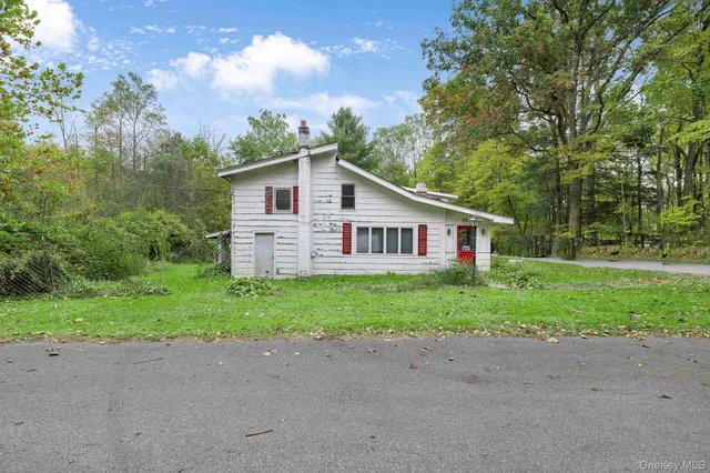 a view of a house and a yard