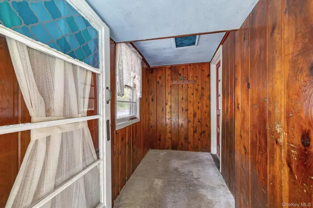 a view of a porch with wooden floor and stairs