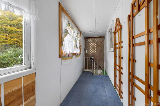 a patio with yard glass top table and chairs