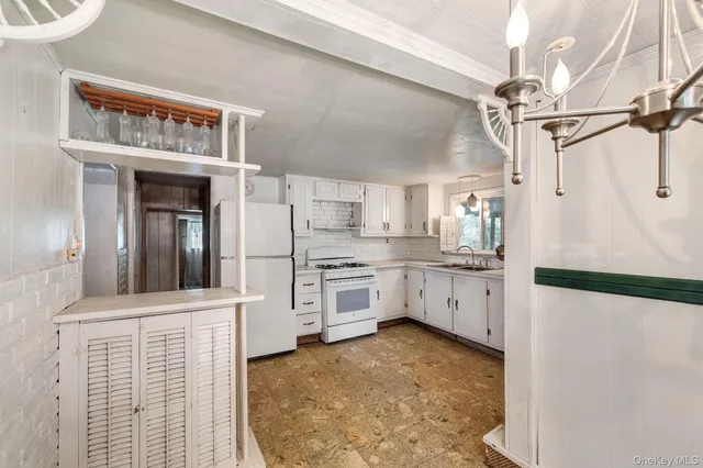a kitchen with stainless steel appliances a refrigerator and cabinets