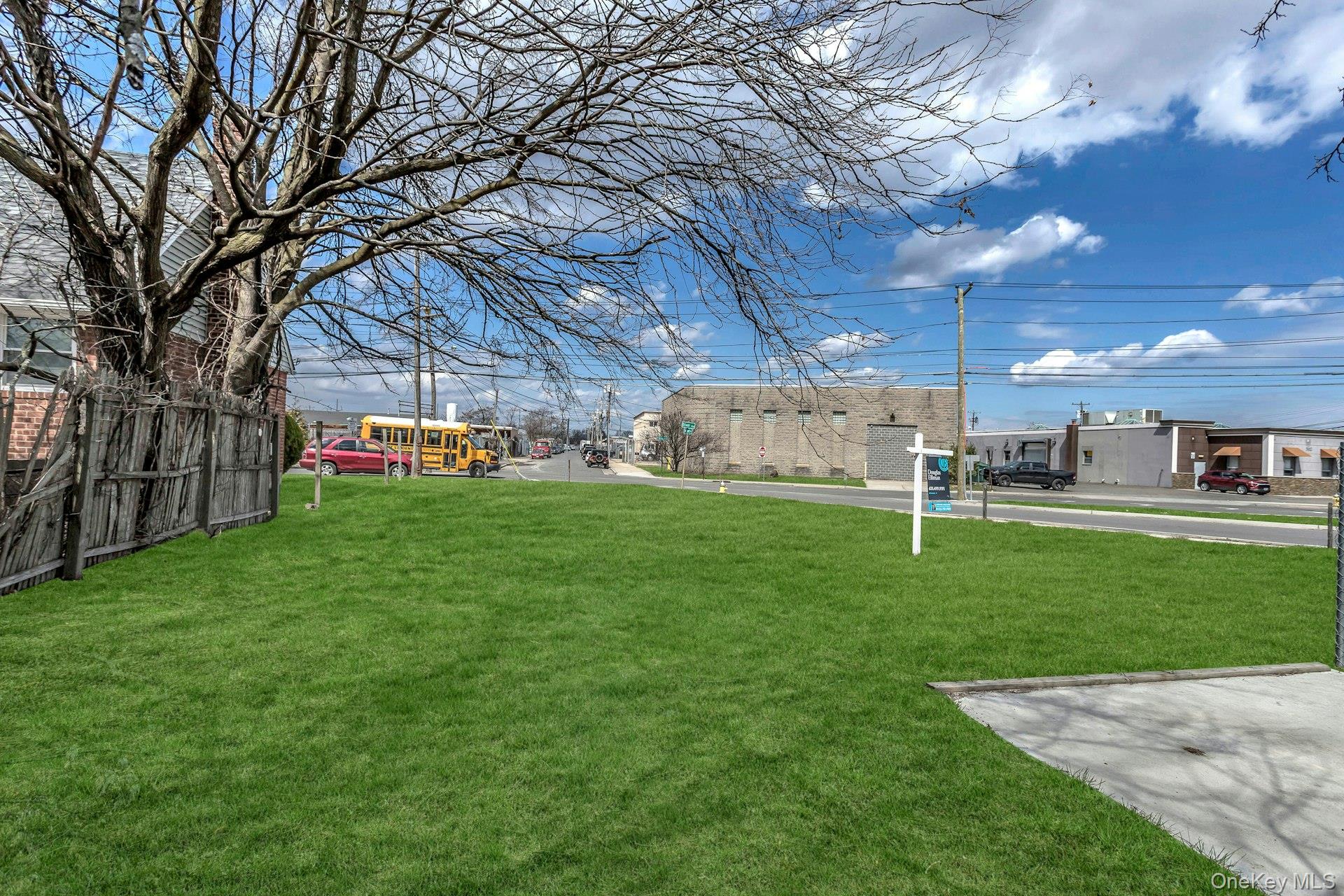 899 Old Country Road Westbury, NY 11590 - Photo 11 of 19 View of yard featuring fence and a playground
