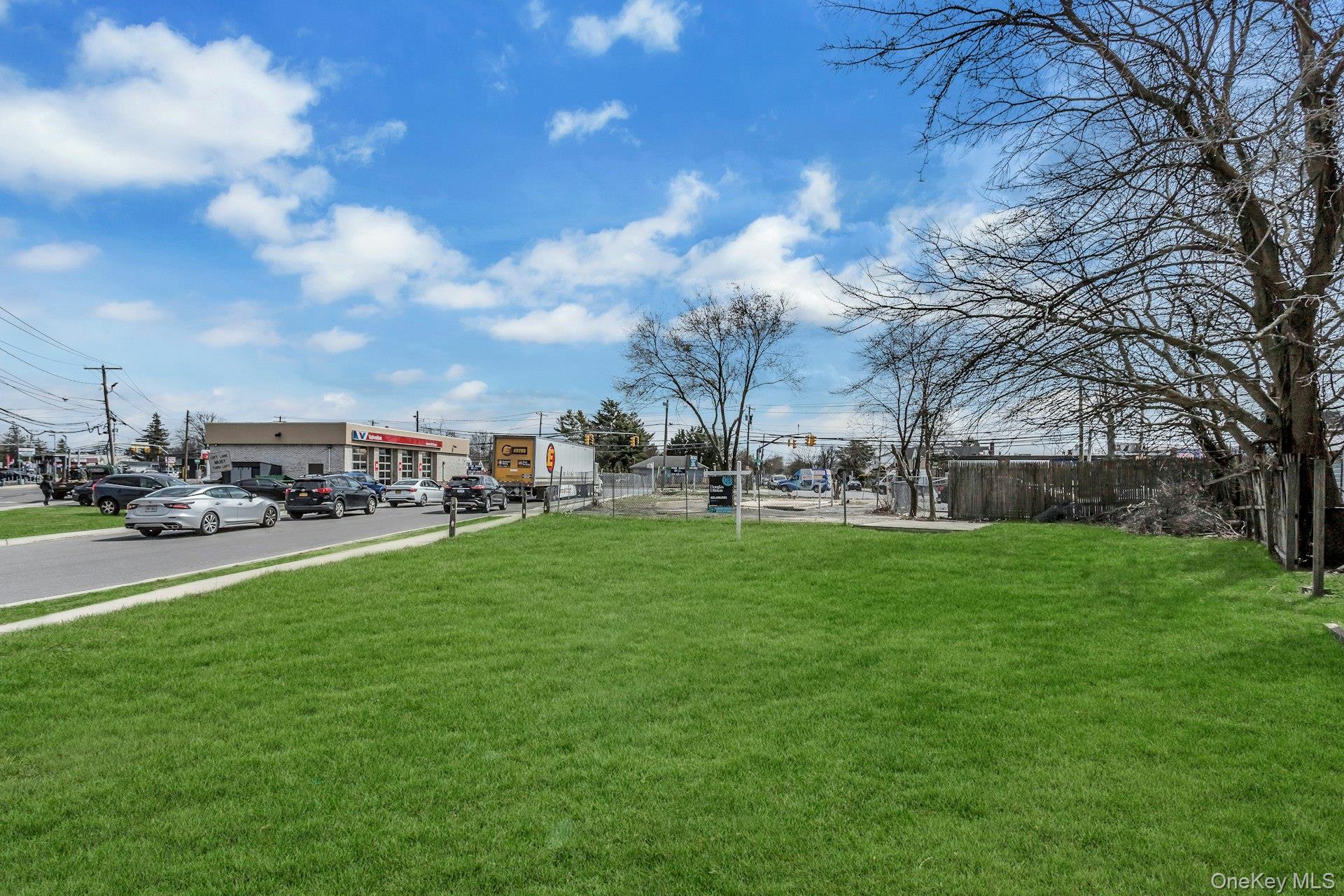 899 Old Country Road Westbury, NY 11590 - Photo 10 of 19 View of yard featuring fence
