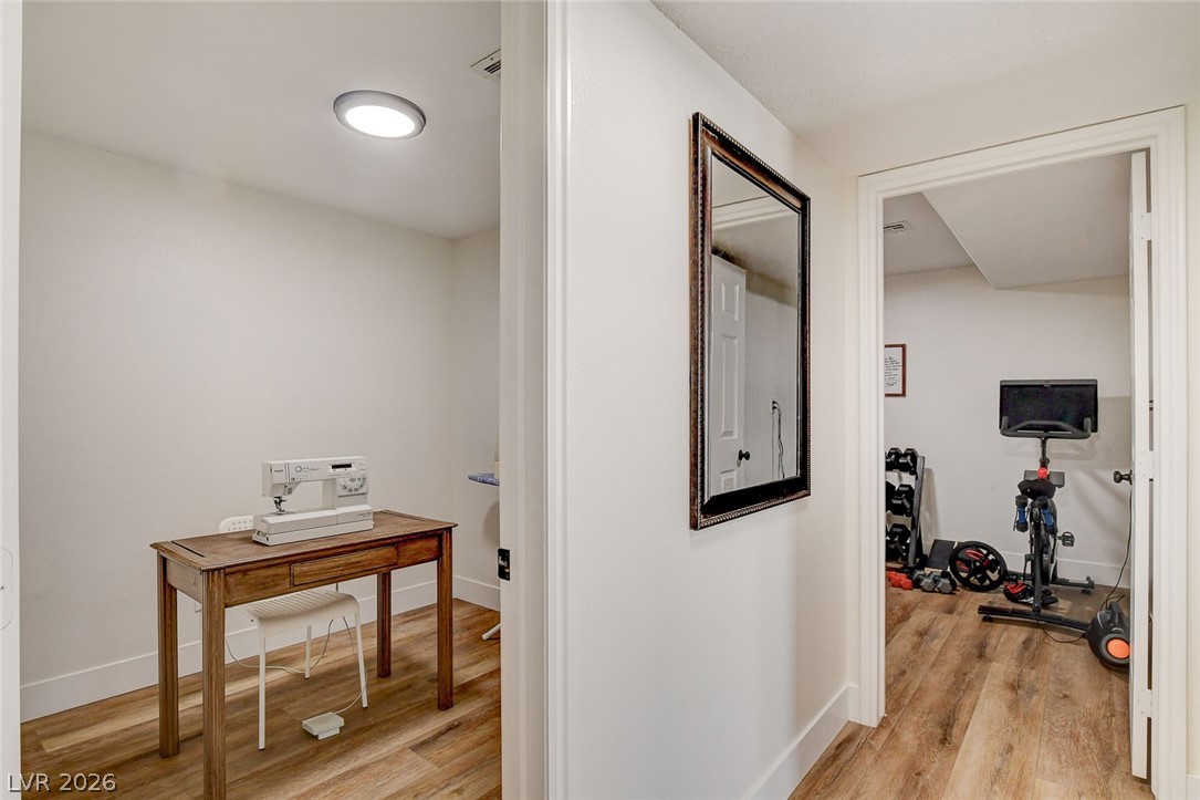 4362 Thistle Street Logandale, NV 89021 - Photo 51 of 99 Versatile interior space featuring durable LVP flooring and modern lighting.