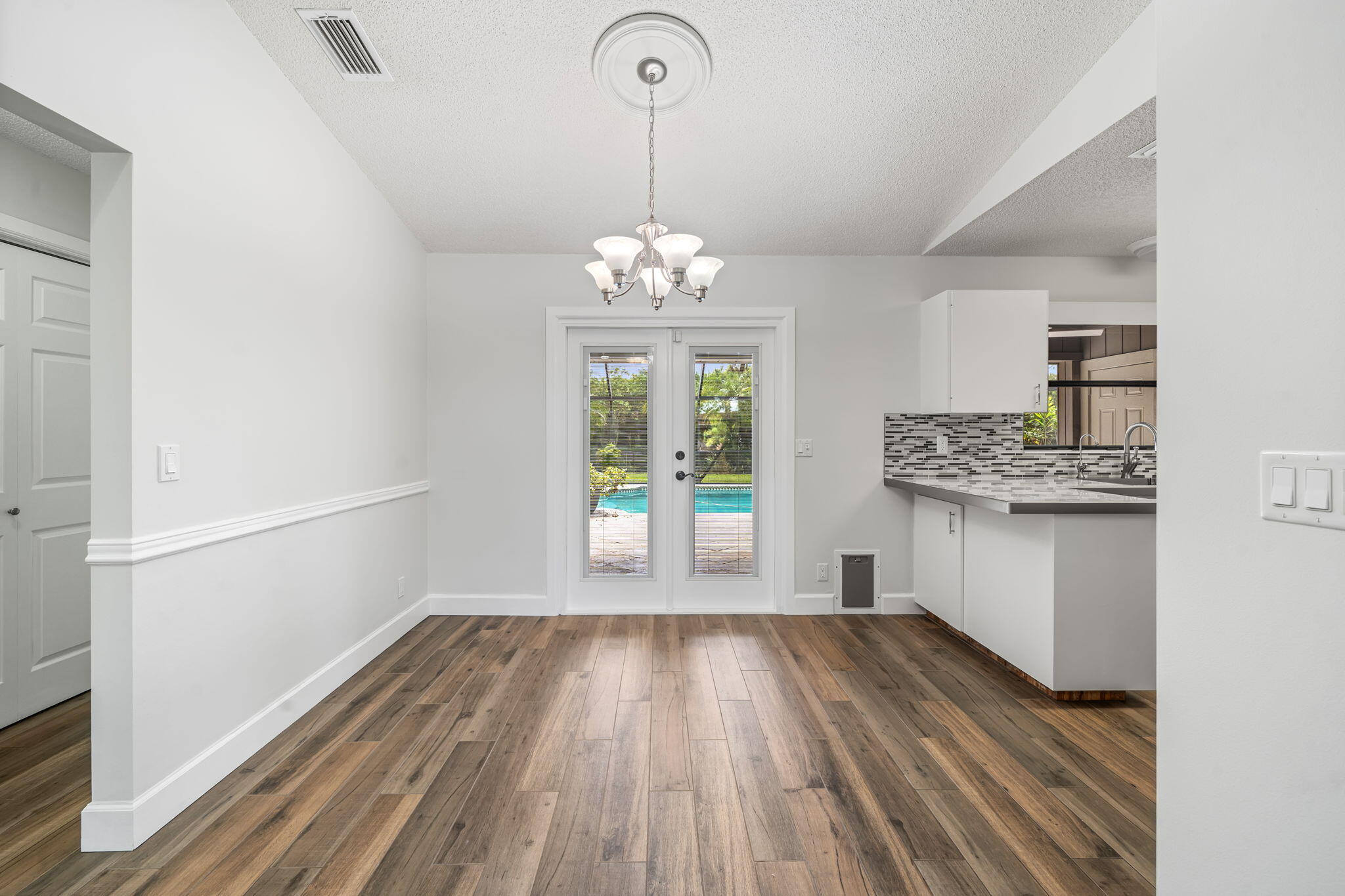 17876 43rd Road North Loxahatchee, FL 33470 - Photo 11 of 37 a view of kitchen and dining room with wooden floor