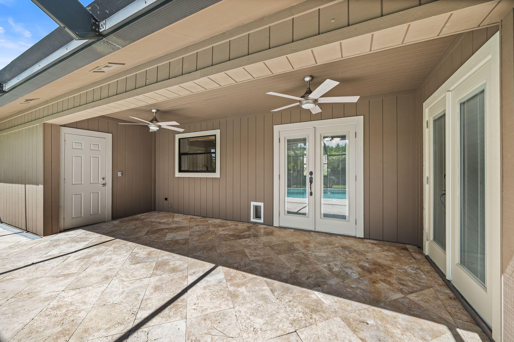 17876 43rd Road North Loxahatchee, FL 33470 - Photo 30 of 37 a bedroom with a large bed and a chandelier