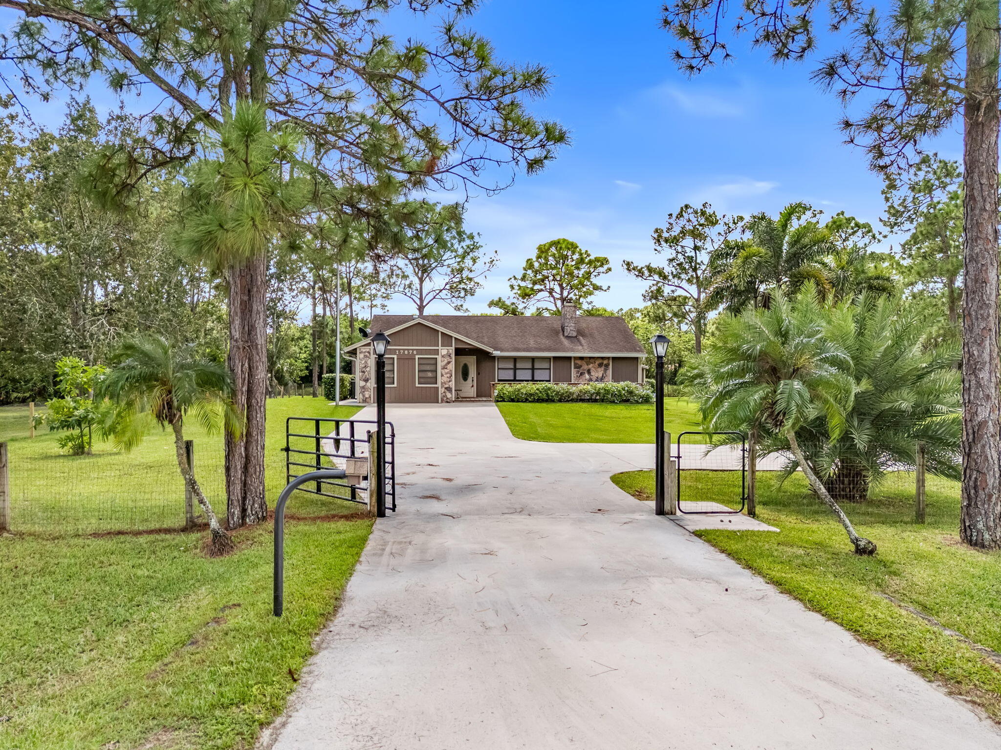 17876 43rd Road North Loxahatchee, FL 33470 - Photo 35 of 37 a view of a park with a bench