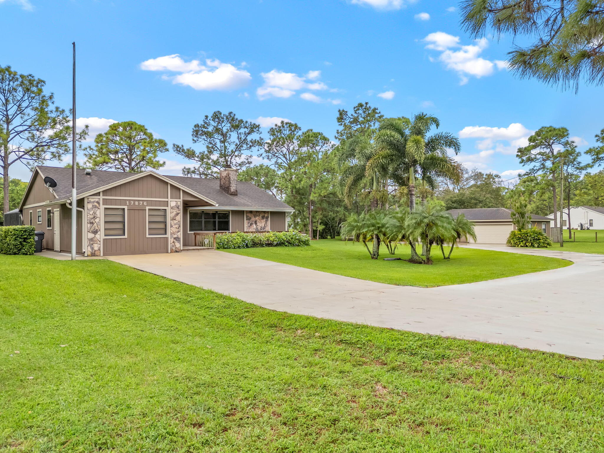 17876 43rd Road North Loxahatchee, FL 33470 - Photo 37 of 37 a front view of a house with a yard