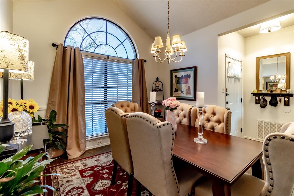 266 East Ridgegate Drive Garland, TX 75040 - Photo 16 of 32 a living room with furniture a chandelier and a table