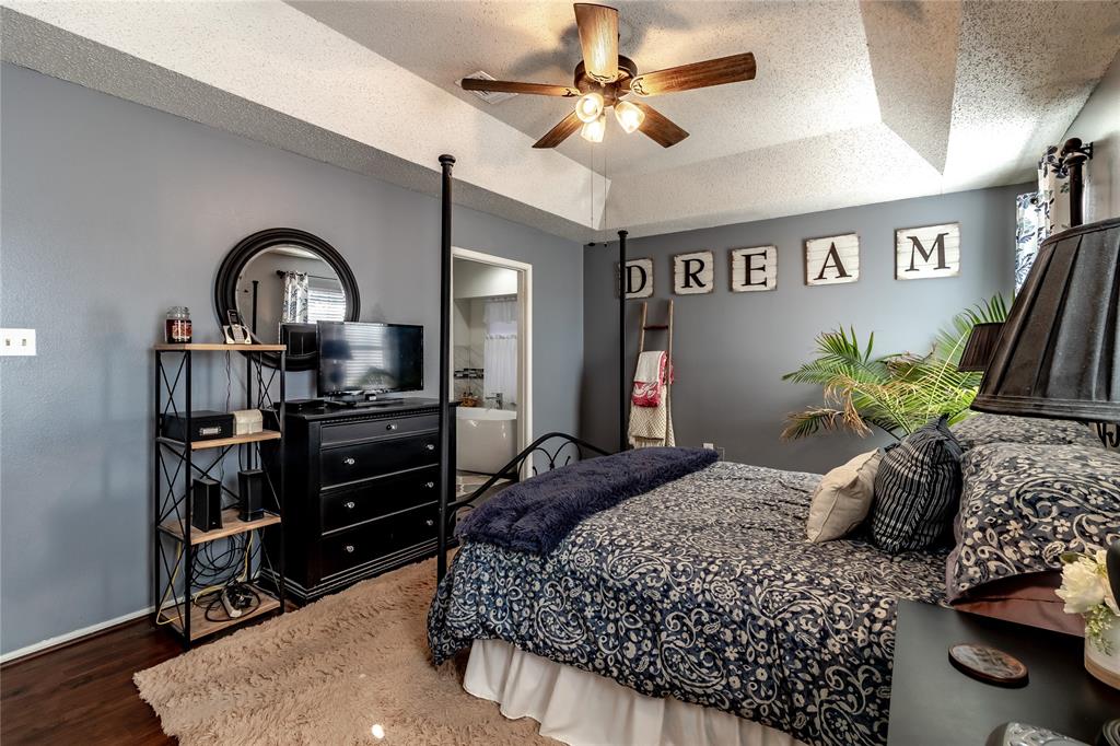 266 East Ridgegate Drive Garland, TX 75040 - Photo 18 of 32 a bedroom with a bed dresser and a window