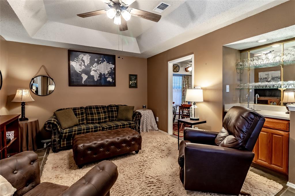 266 East Ridgegate Drive Garland, TX 75040 - Photo 8 of 32 a living room with furniture and a large mirror