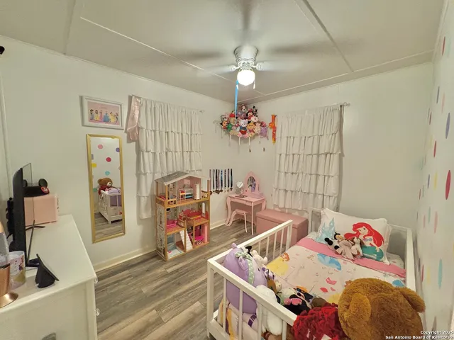 a bedroom with furniture and a chandelier
