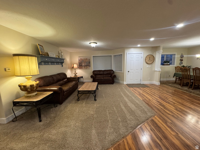 655 North 8th East Preston, ID 83263 - Photo 5 of 32 Living room with baseboards and dark wood-style floors