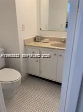 a close view of a sink and a toilet