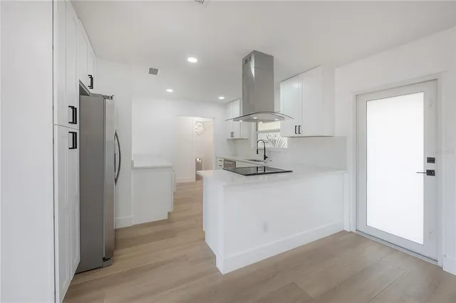a view of a balcony with wooden floor