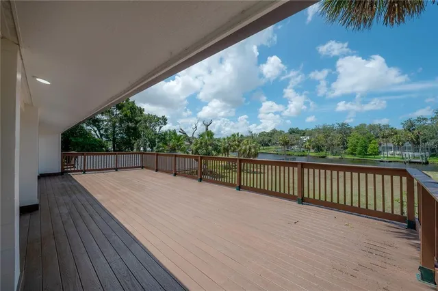 an empty room with wooden floor and window
