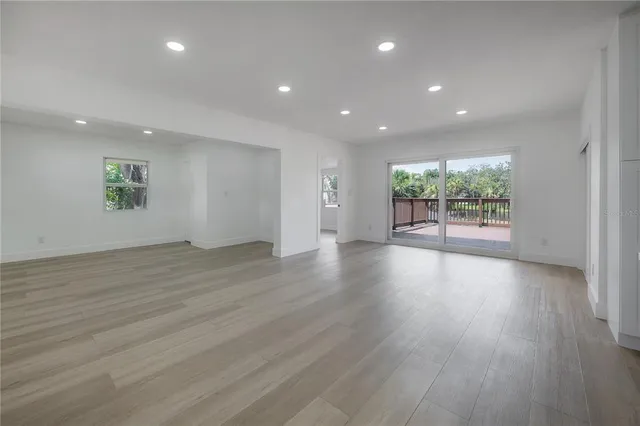 a kitchen with a refrigerator and a sink