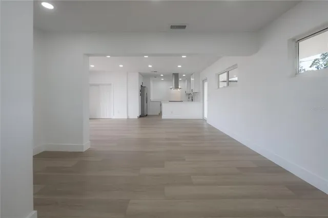 a kitchen with a sink cabinets and window