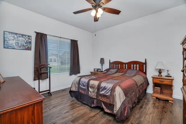 a bedroom with bed and a window
