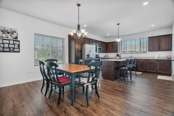a view of a dining room with furniture window and wooden floor