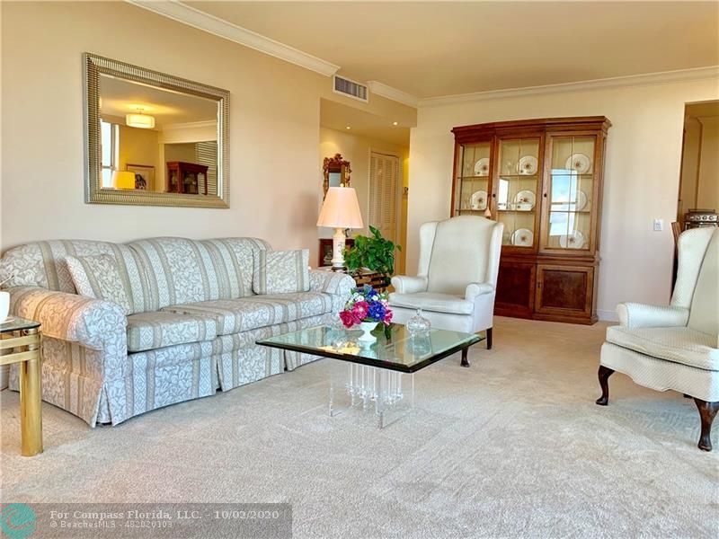 Spacious Living Room features smooth ceilings and crown molding