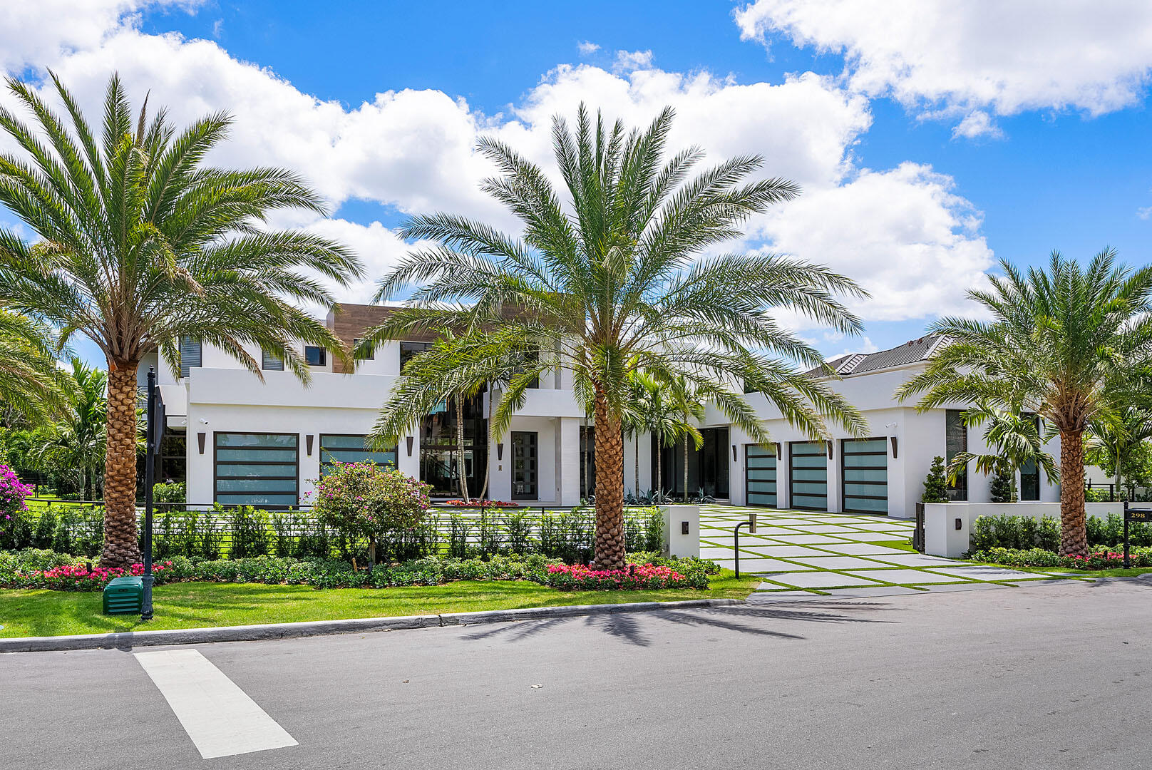 298 West Key Palm Road Boca Raton, FL 33432 - Photo 2 of 82 a front view of a house with a garden and porch
