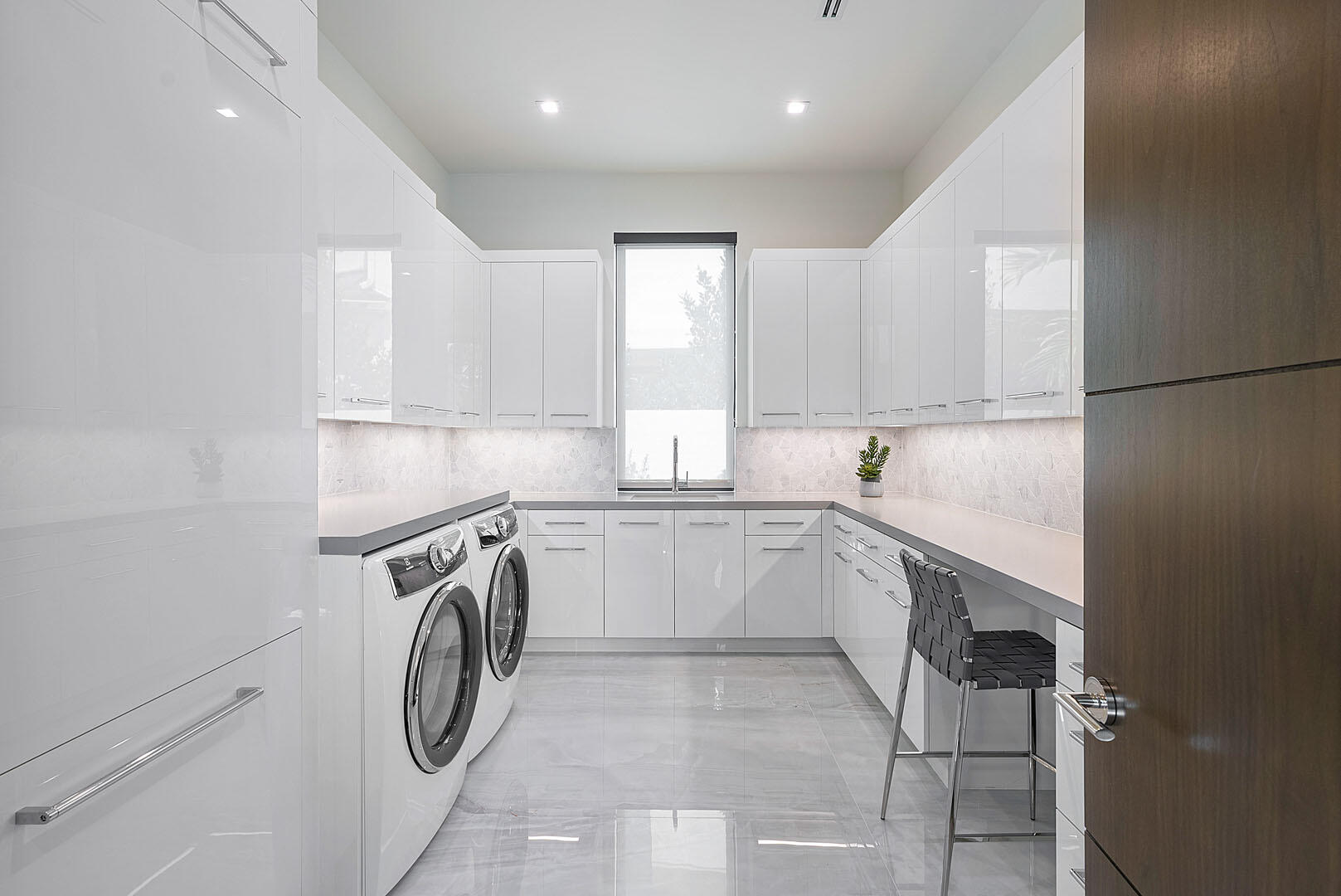 298 West Key Palm Road Boca Raton, FL 33432 - Photo 42 of 82 a utility room with cabinets washer and dryer