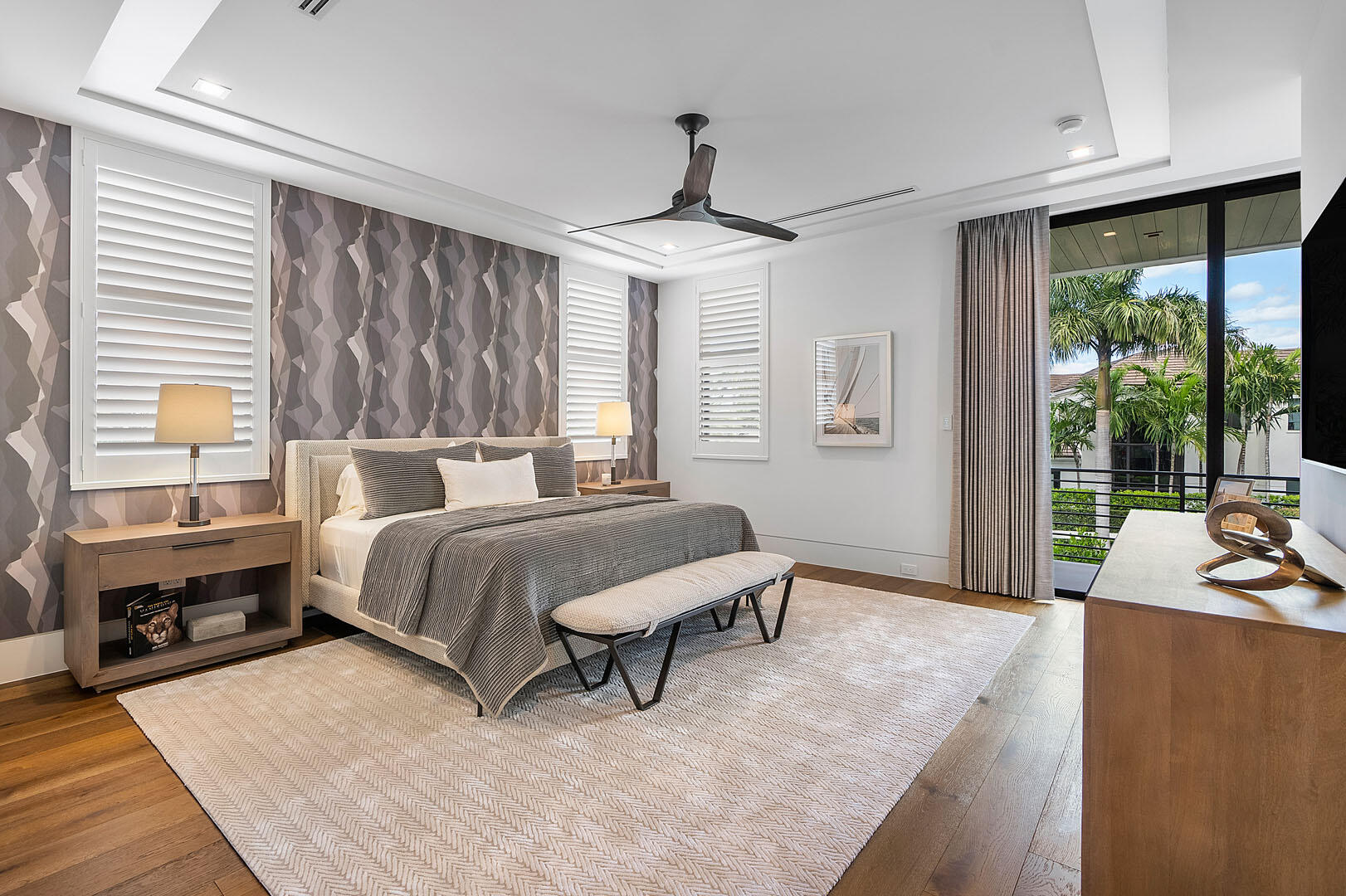 298 West Key Palm Road Boca Raton, FL 33432 - Photo 49 of 82 a spacious bedroom with a bed a table and three large window