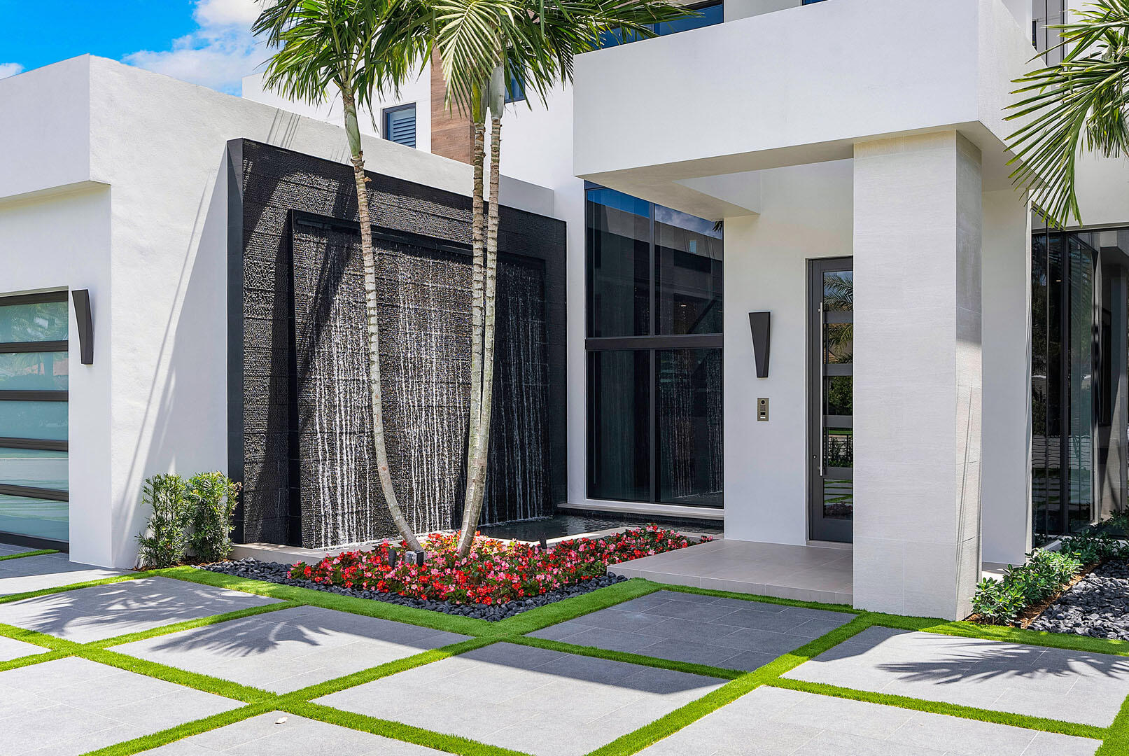 298 West Key Palm Road Boca Raton, FL 33432 - Photo 5 of 82 a front view of a house with a yard