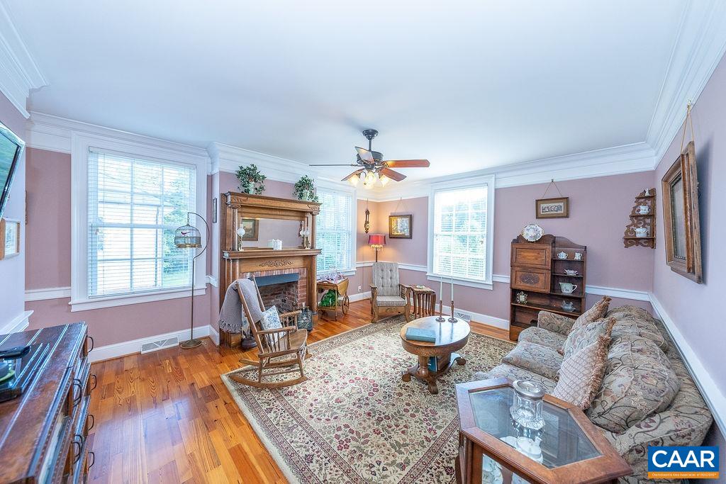 1571 Celt Road Stanardsville, VA 22973 - Photo 11 of 66 a living room with furniture windows and a flat screen tv