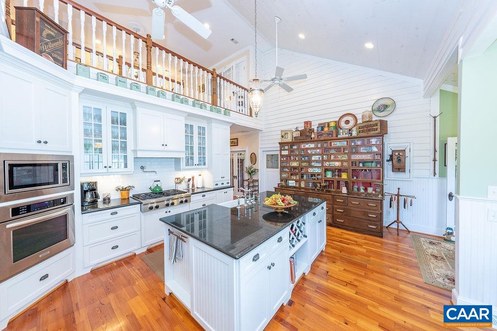 1571 Celt Road Stanardsville, VA 22973 - Photo 14 of 66 a kitchen with stainless steel appliances granite countertop a sink a stove and a refrigerator