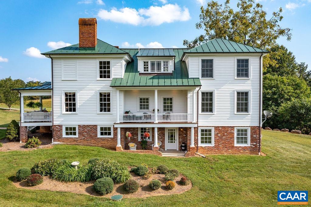 1571 Celt Road Stanardsville, VA 22973 - Photo 2 of 66 a front view of a house with a garden