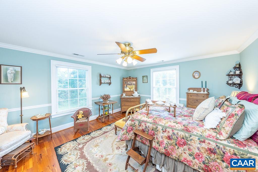 1571 Celt Road Stanardsville, VA 22973 - Photo 28 of 66 a bedroom with a bed and wooden floor