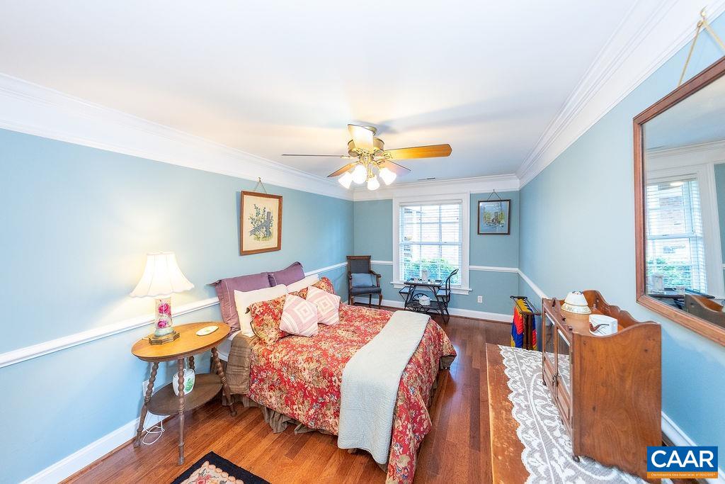 1571 Celt Road Stanardsville, VA 22973 - Photo 42 of 66 a bed room with a bed and a chandelier