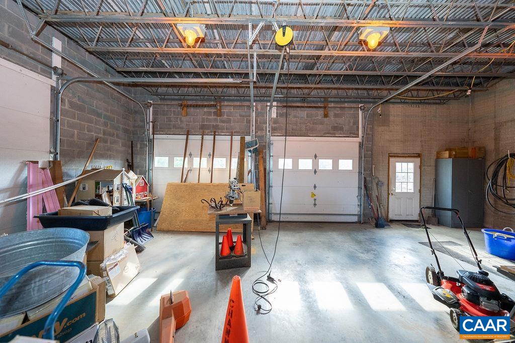 1571 Celt Road Stanardsville, VA 22973 - Photo 50 of 66 a living room with furniture a chandelier and a window