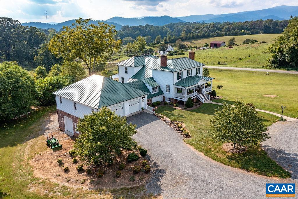 1571 Celt Road Stanardsville, VA 22973 - Photo 52 of 66 an aerial view of a house with a garden and lake view