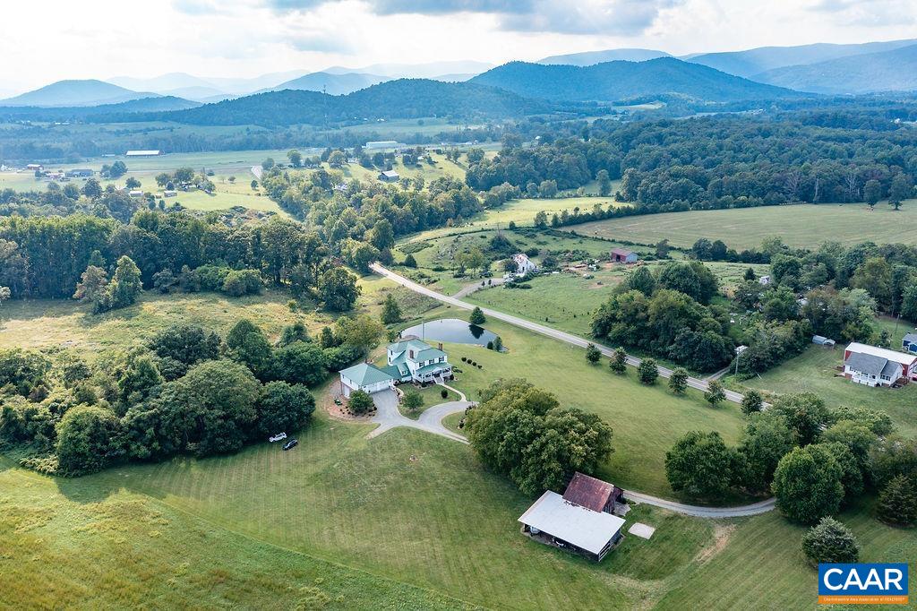1571 Celt Road Stanardsville, VA 22973 - Photo 60 of 66 a view of a lush green hillside and houses