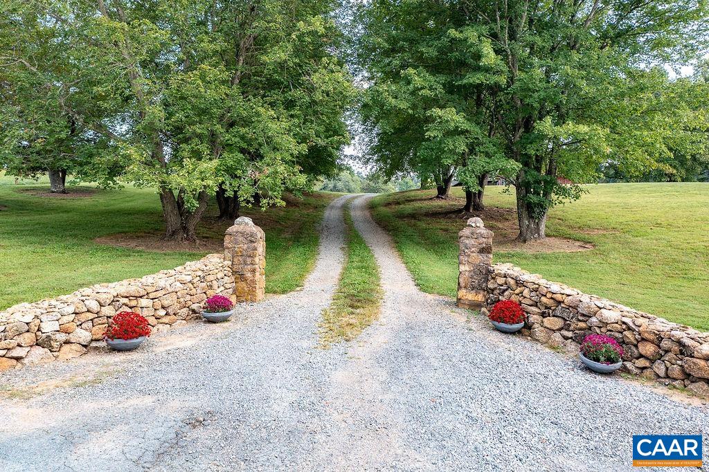 1571 Celt Road Stanardsville, VA 22973 - Photo 63 of 66 a view of a lake with a sitting area