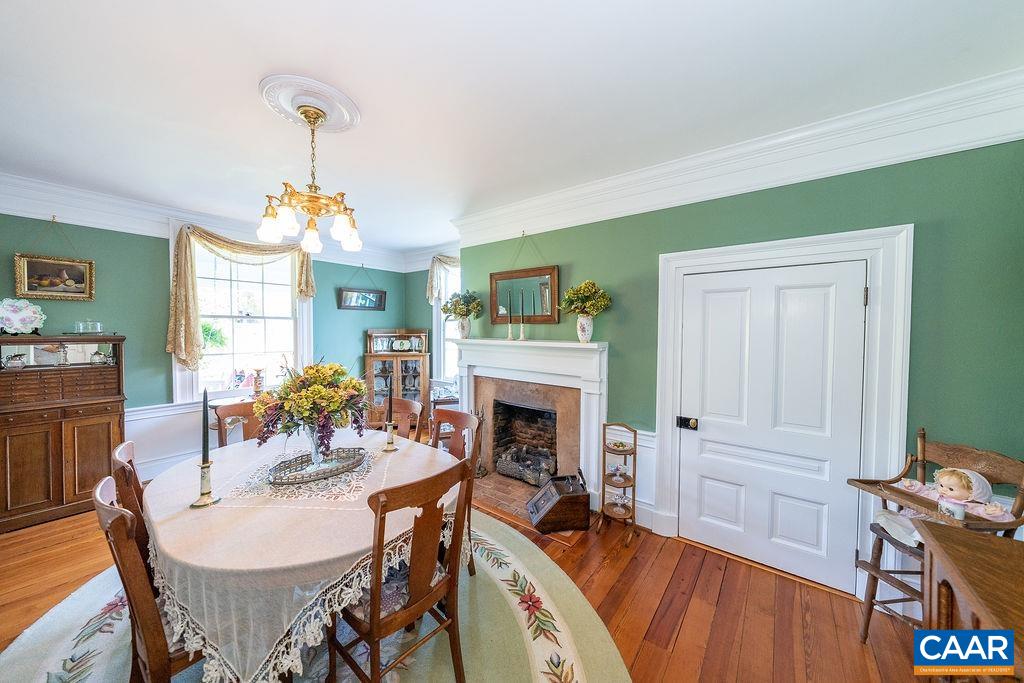 1571 Celt Road Stanardsville, VA 22973 - Photo 10 of 66 a view of a dining room with furniture window and wooden floor