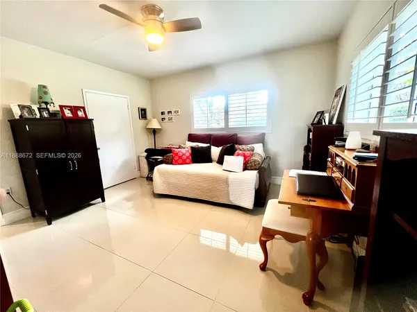 a living room with furniture and a window