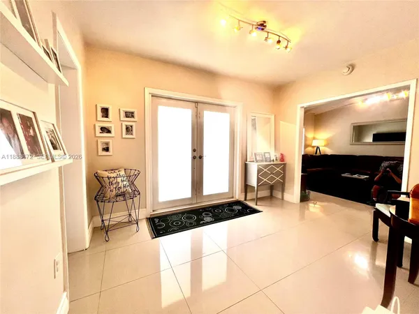 a spacious bedroom with a bed and window