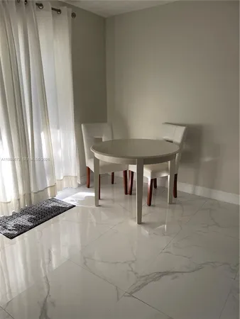 a workspace with furniture and a flat screen tv