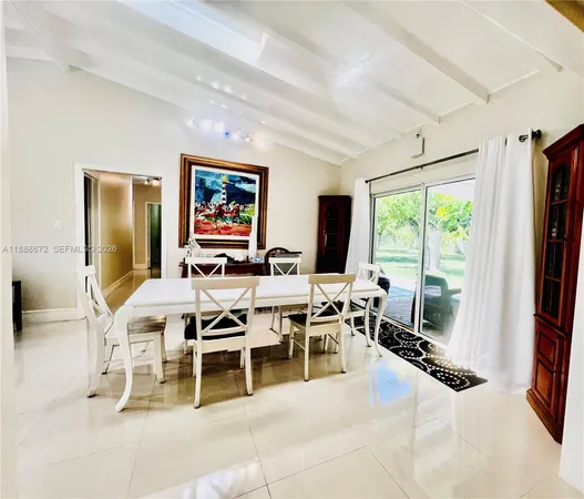 a living room with a large window and a table