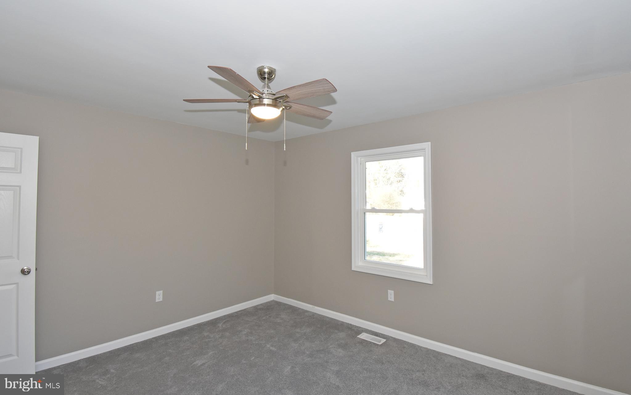 516 Overbrook Drive Salisbury, MD 21801 - Photo 22 of 48 an empty room with windows and fan