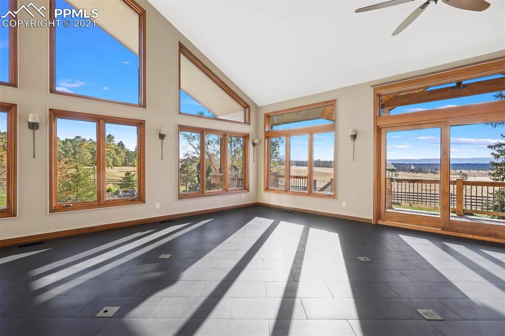 Undisclosed Address Larkspur, CO 80118 - Photo 5 of 39 a view of an empty room with wooden floor and a window