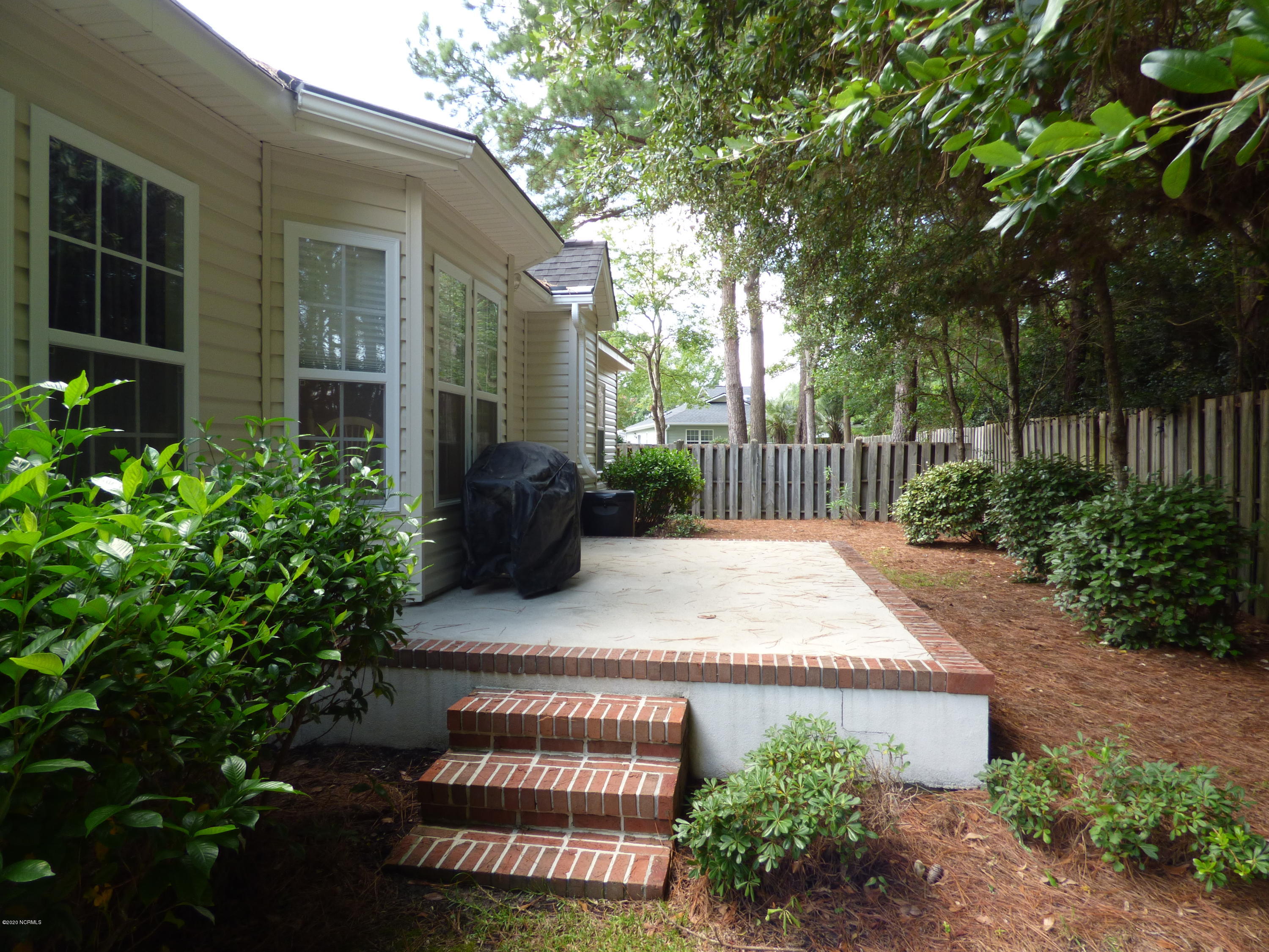 67 Cedar Tree Lane Southwest Calabash, NC 28467 - Photo 27 of 39 Back yard patio