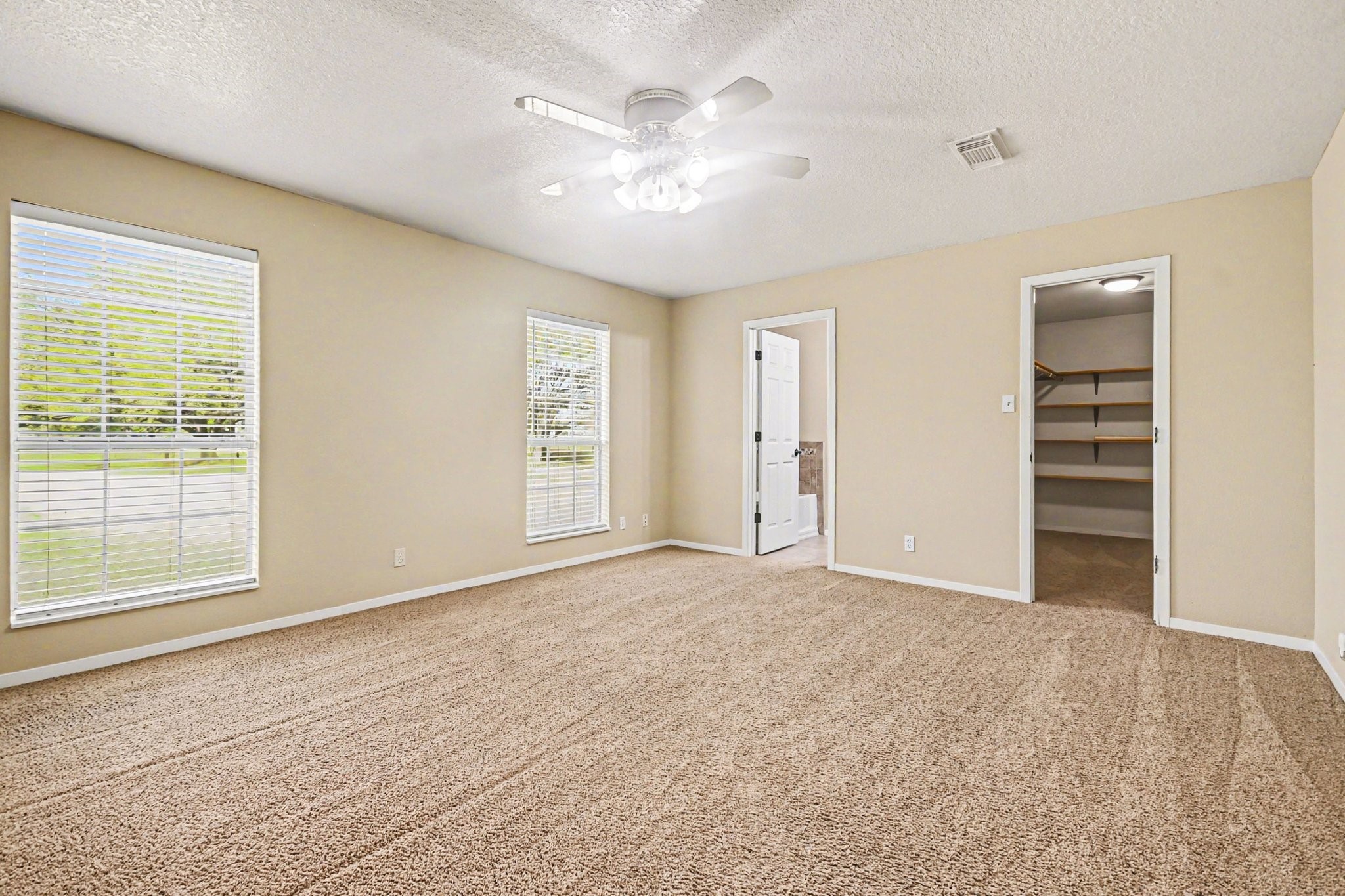 21503 Pecan Bend Road Damon, TX 77430 - Photo 18 of 45 a view of an empty room with a window
