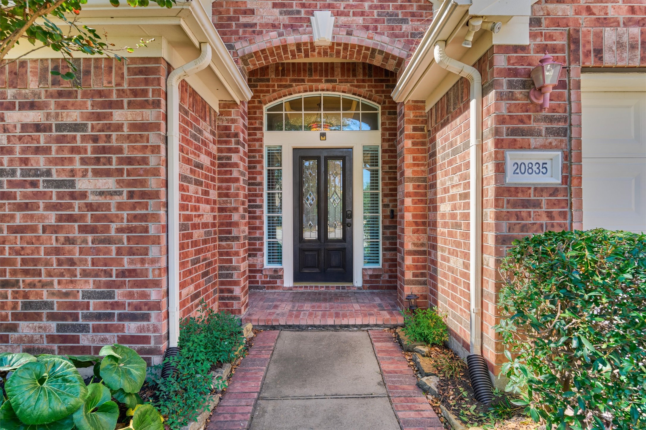 20835 Louetta Oak Drive Spring, TX 77388 - Photo 9 of 37 a front view of a building with a pathway