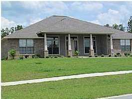 3056 Wallace Lake Road Pace, FL 32571 - Photo 1 of 19 a view of a house with backyard and garden